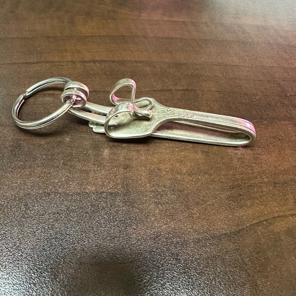 Silver fork bent into a key chain. It could also be worn as a necklace - Picture 3 of 3